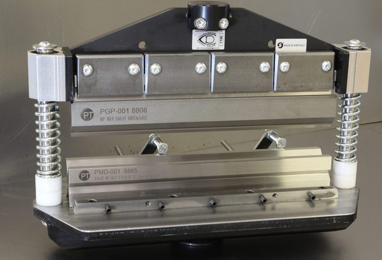 Metal cutting tool with adjustable clamps and multiple blades for precise cuts.